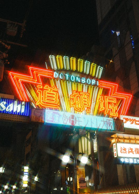 Vibrant neon lights reflecting in the Dotonbori canal in Osaka at night